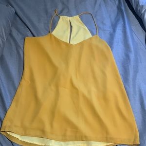 Size medium reverse able yellow and mustard colored tank top.